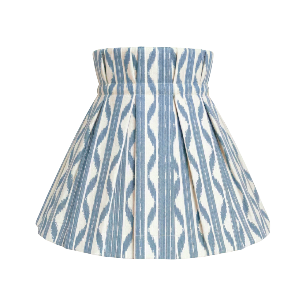 Blue and white patterned shade cover on a white background