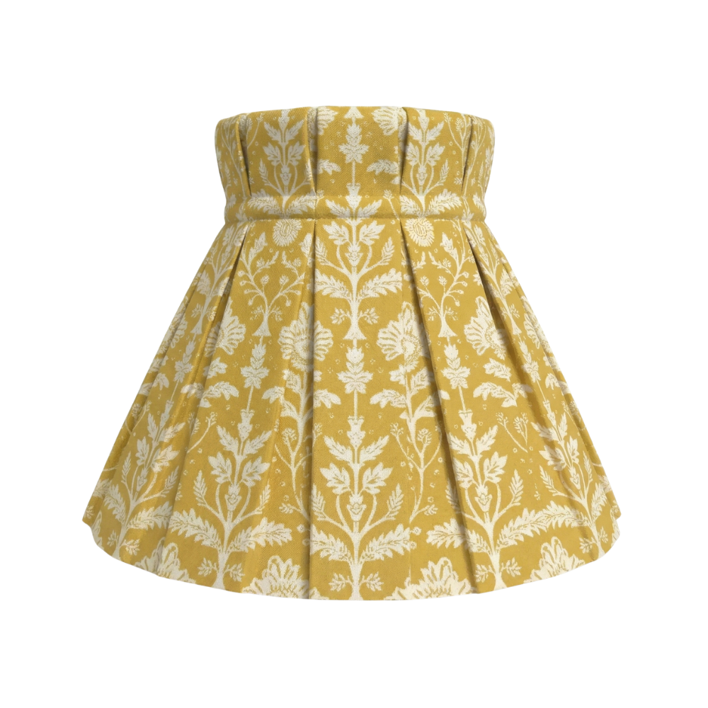 Yellow shade cover with white floral pattern on a white background