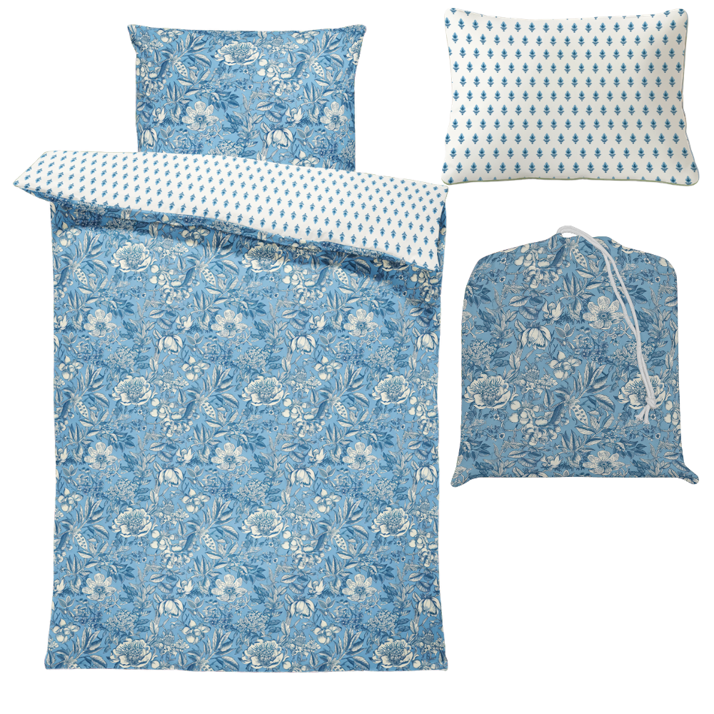 Blue floral bedding set with matching pillowcases on a white background