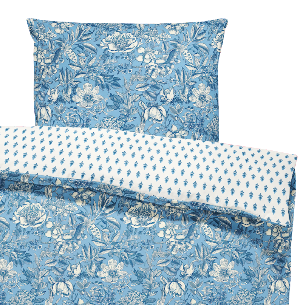 Floral patterned bedding set with blue and white design on a white background