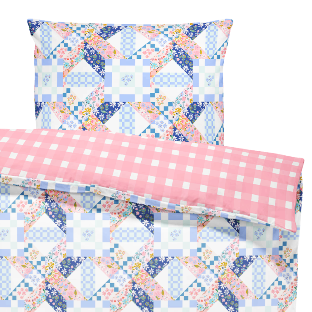 Quilt with floral and checkered patterns on a white background