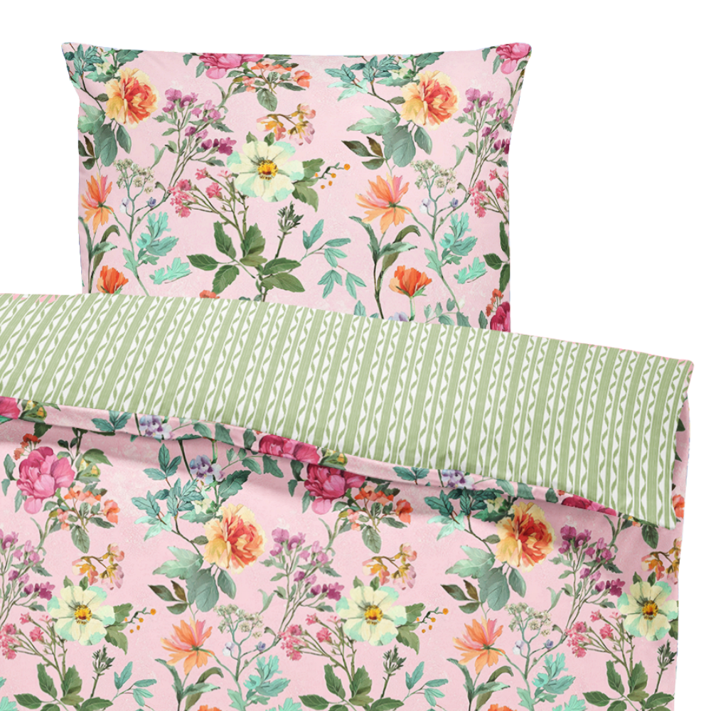 Floral bedding set with pink and green patterns on a white background