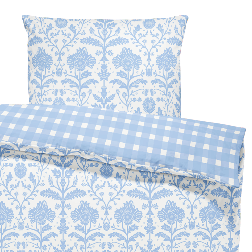 Floral and checkered patterned fabric swatches in blue and white.