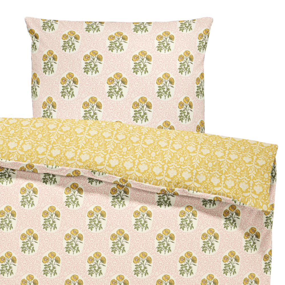 Floral patterned fabric with yellow and green design on a beige background