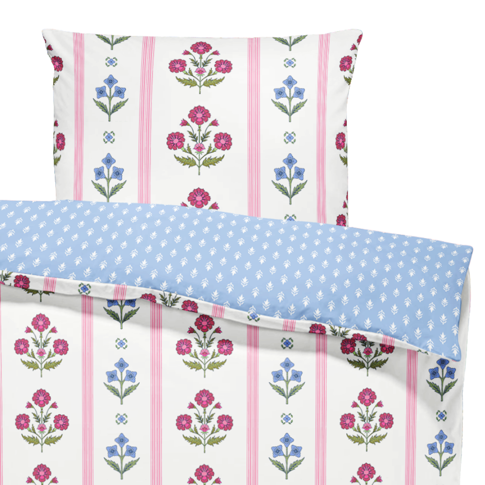 Floral and striped fabric swatch with pink flowers and blue polka dots on a white background