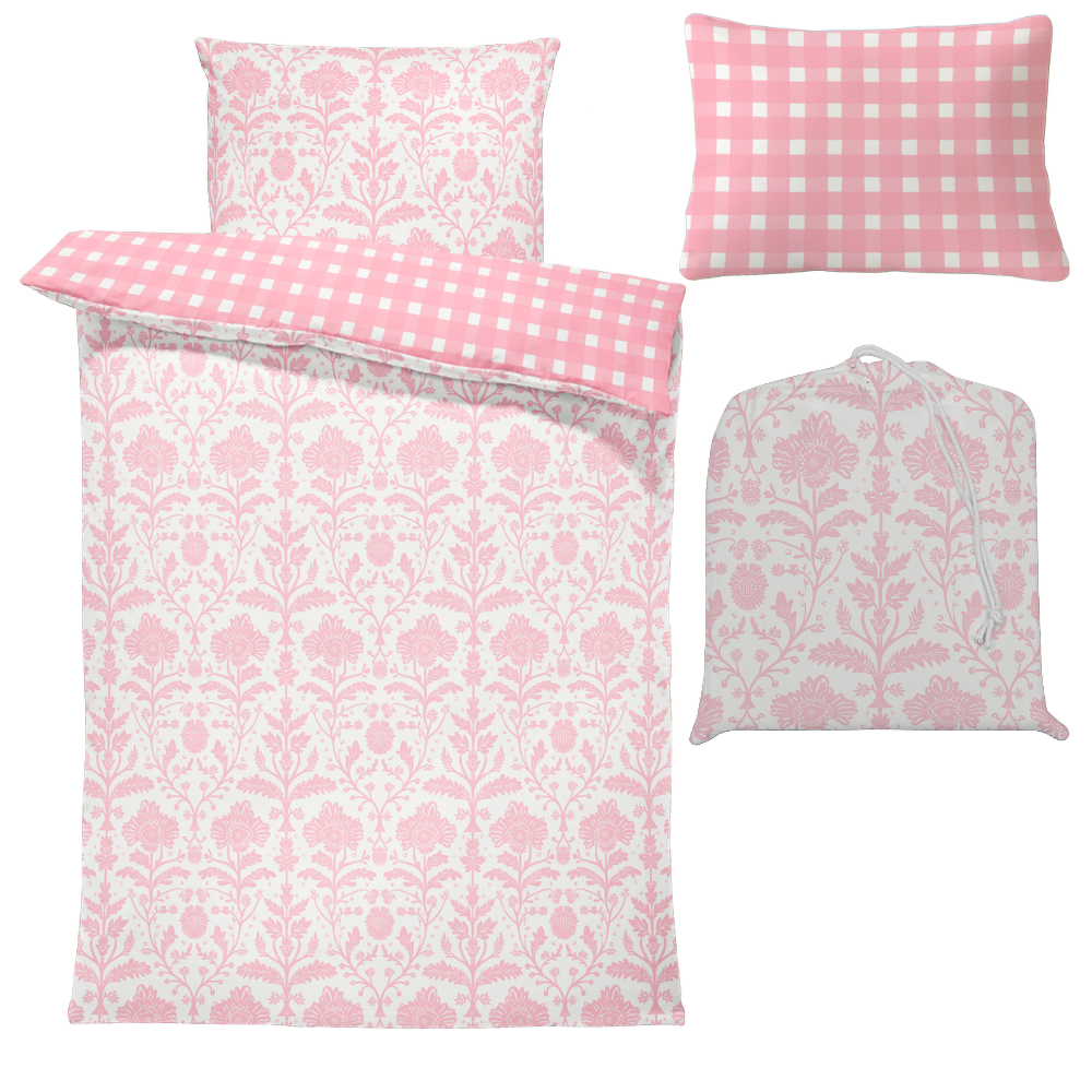Pink and white patterned bedding set with a coverall bag on a white background