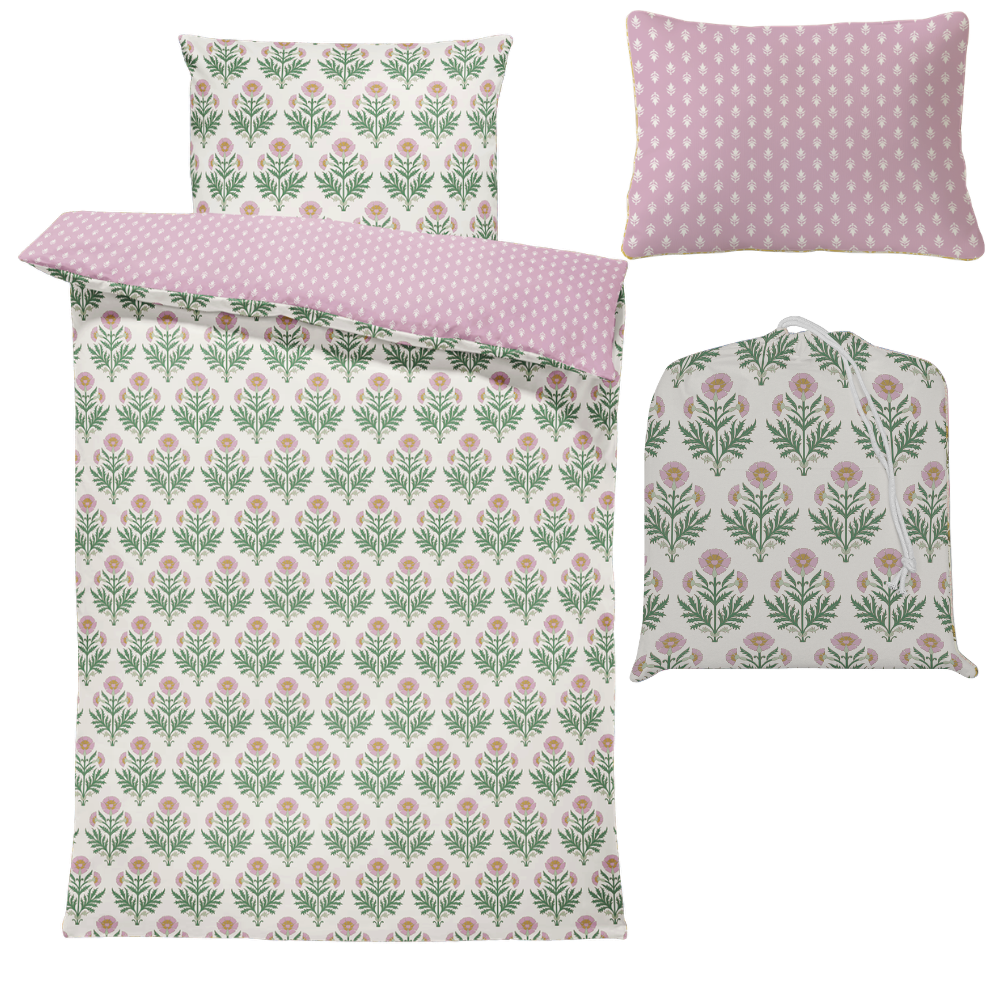 Floral and polka dot patterned bedding set on a white background
