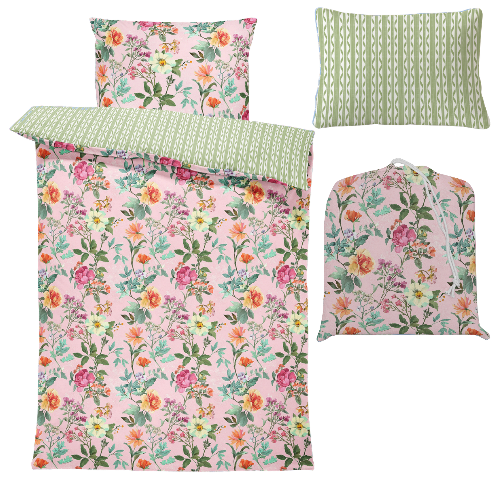 Floral bedding set with matching coverlet, pillowcases, and bag on a white background