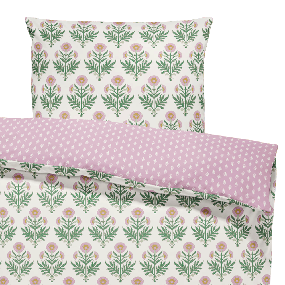 Floral and polka dot patterned pillowcases on a white background