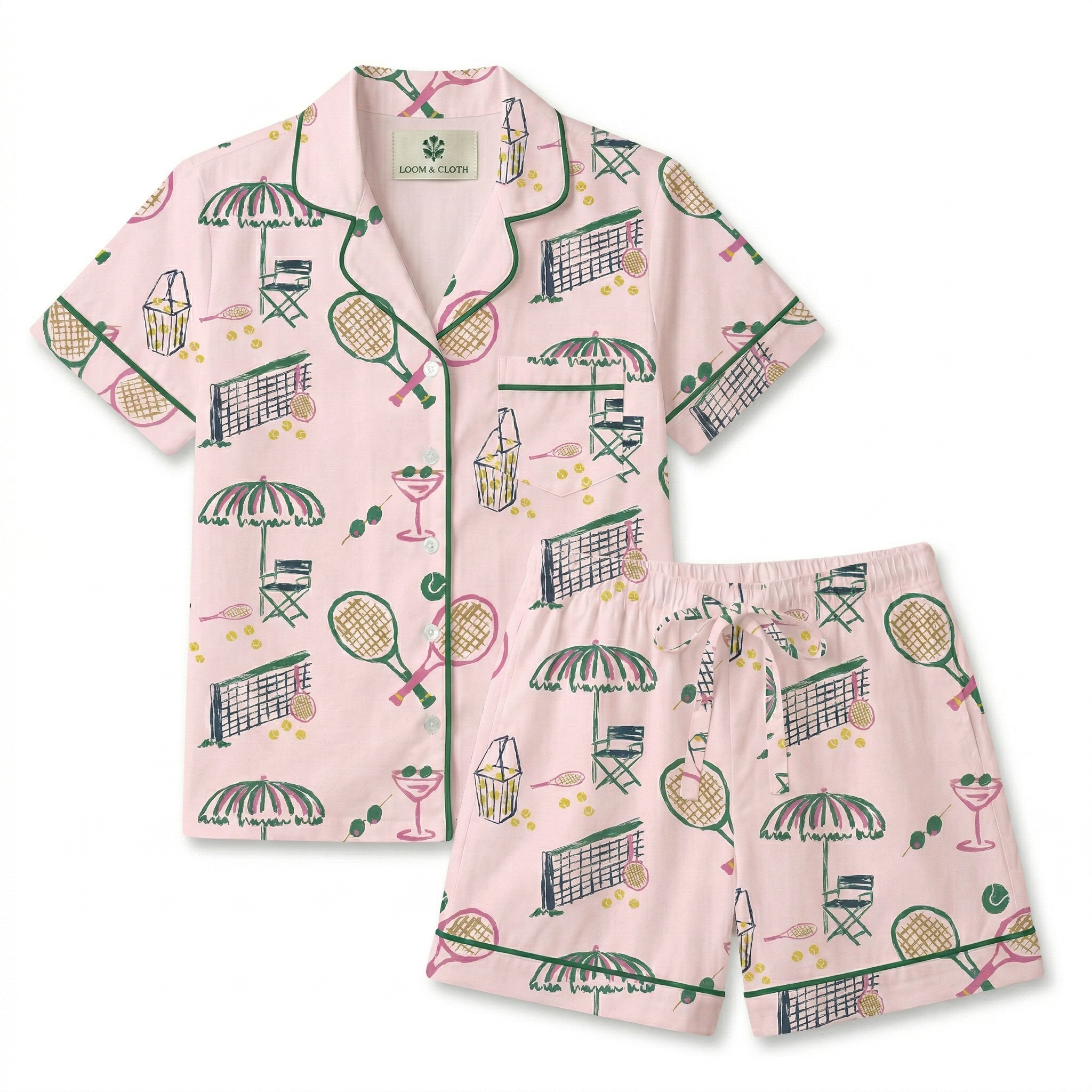 Pink pajama set with tennis-themed pattern on a white background