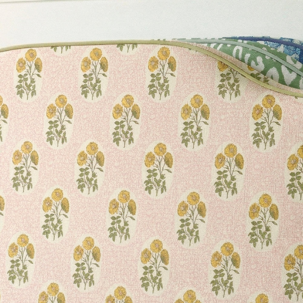 Fabric with floral pattern on a pink background