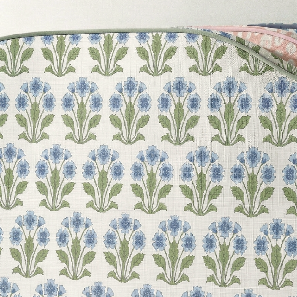 Fabric with blue floral pattern on a white background
