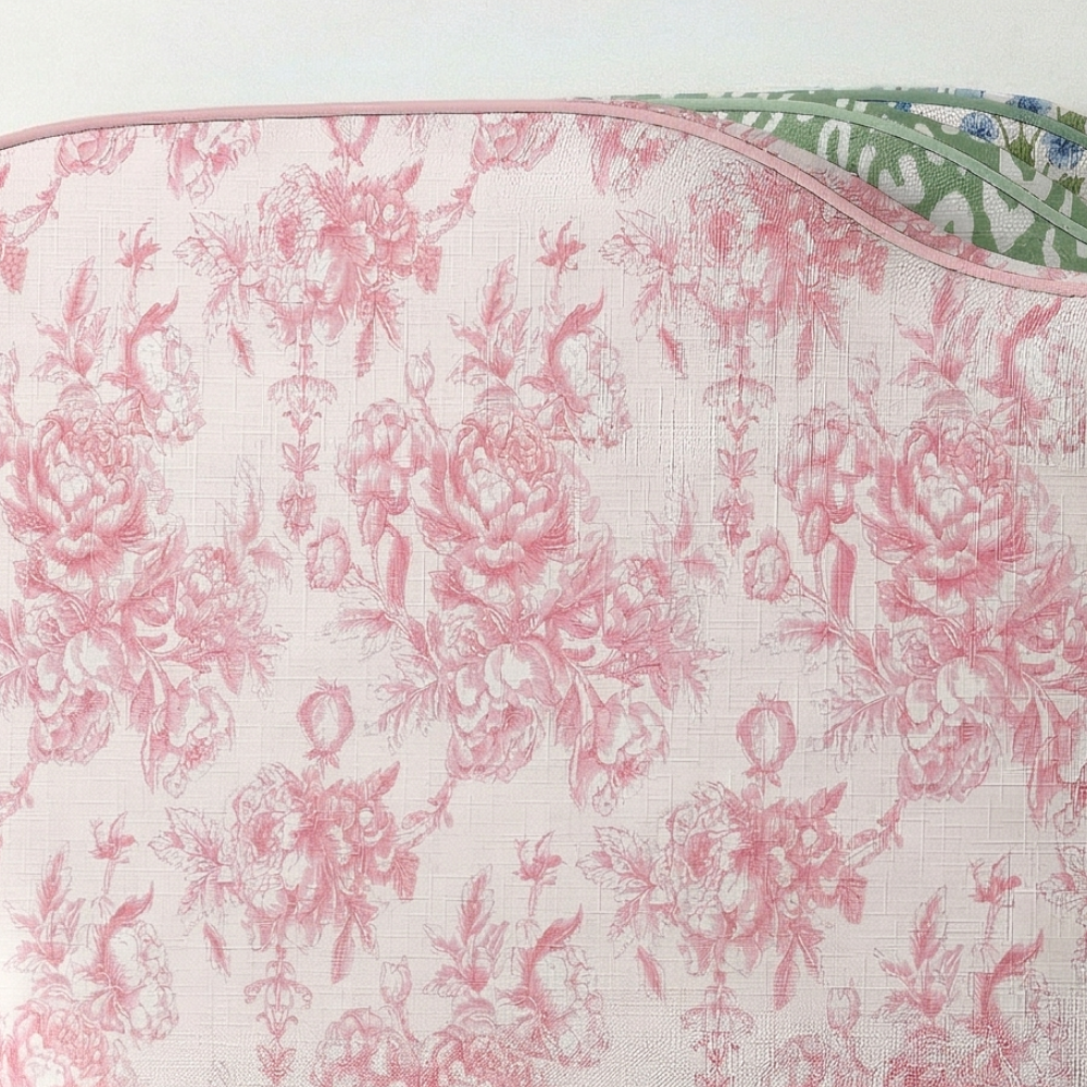 Floral patterned fabric with pink flowers on a white background