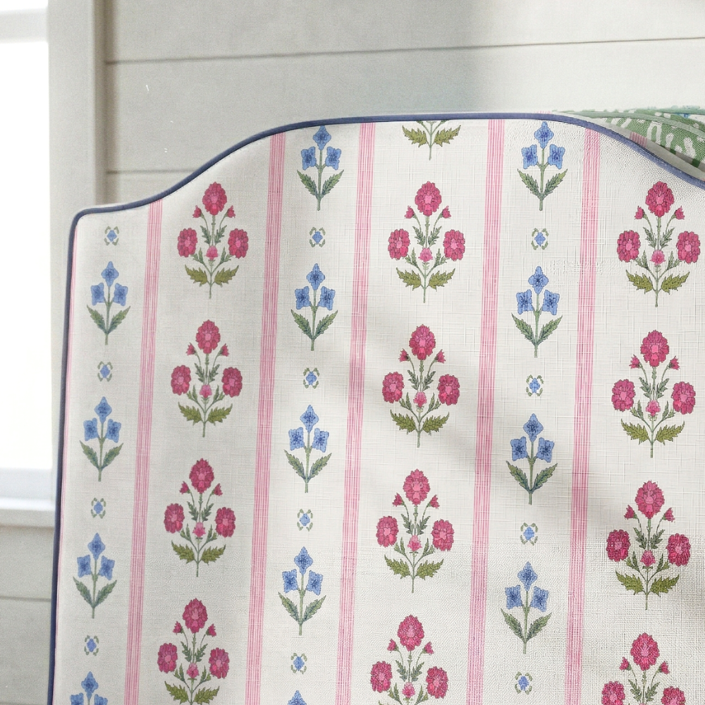 Floral patterned fabric with pink and blue flowers on a white background