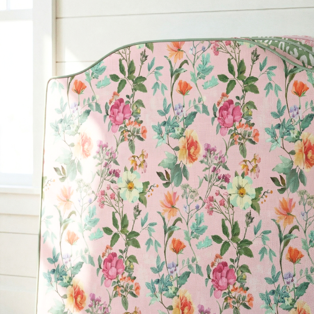 Floral-patterned ironing board cover on a white background