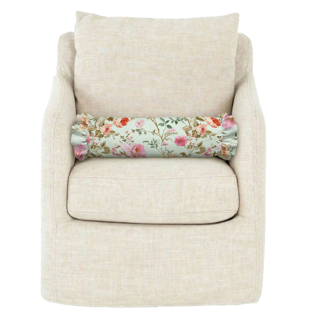 Beige armchair with a floral-patterned cushion on a white background