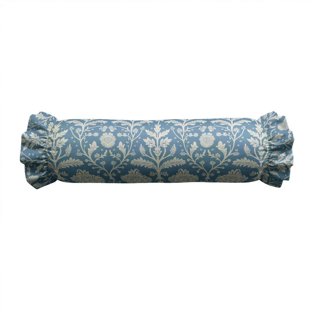 Blue cylindrical pillow with floral pattern on a white background