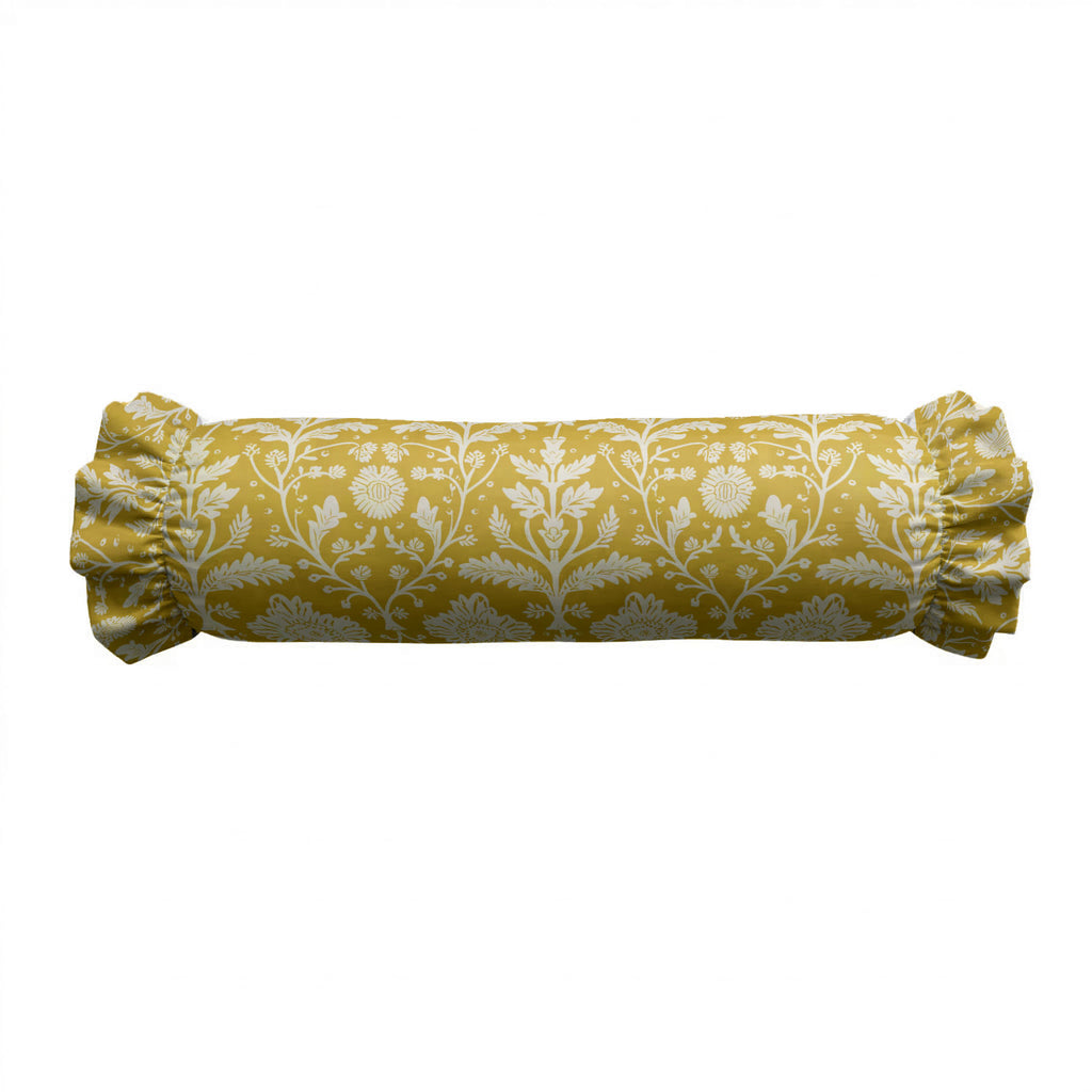 Yellow cylindrical pillow with white floral pattern on a white background