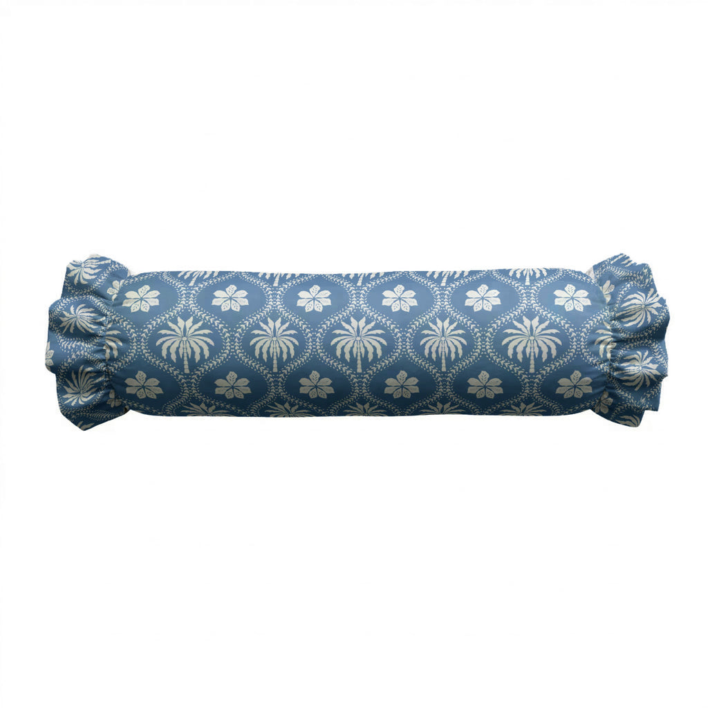 Blue cylindrical pillow with white floral pattern on a white background