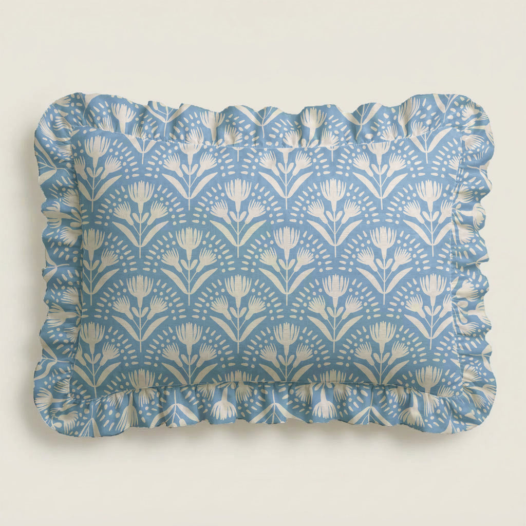 Rectangular tray with blue floral pattern and ruffled edge on a light gray background