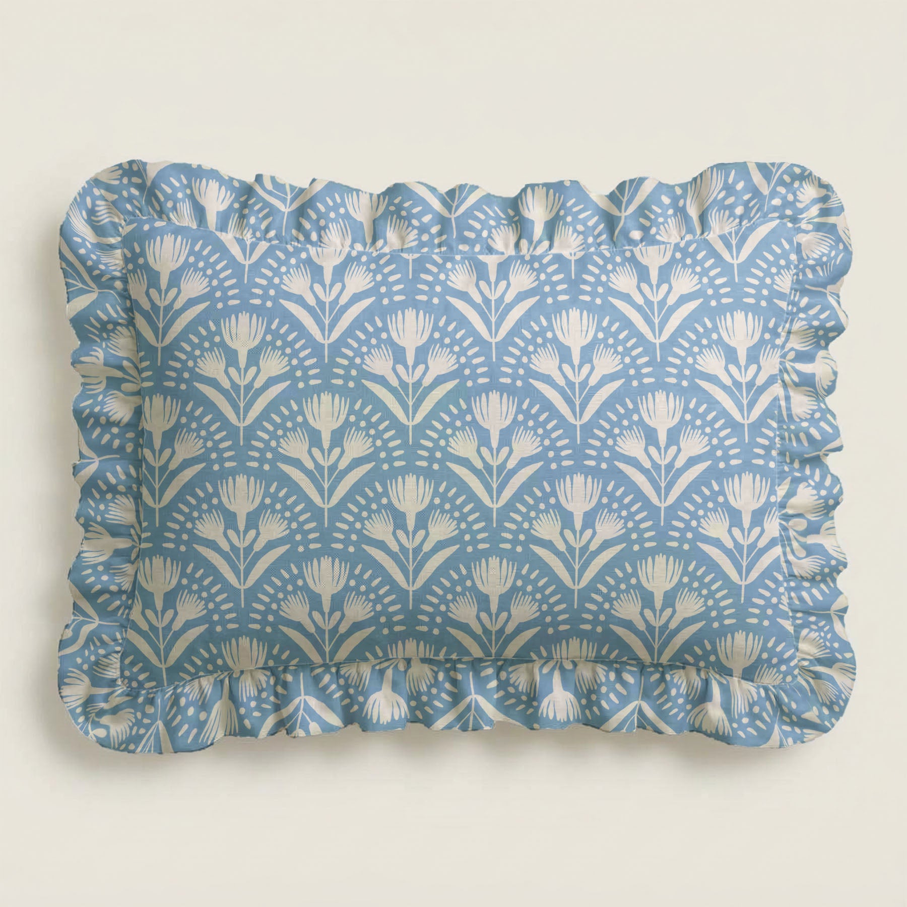 Rectangular tray with blue floral pattern and ruffled edge on a light gray background