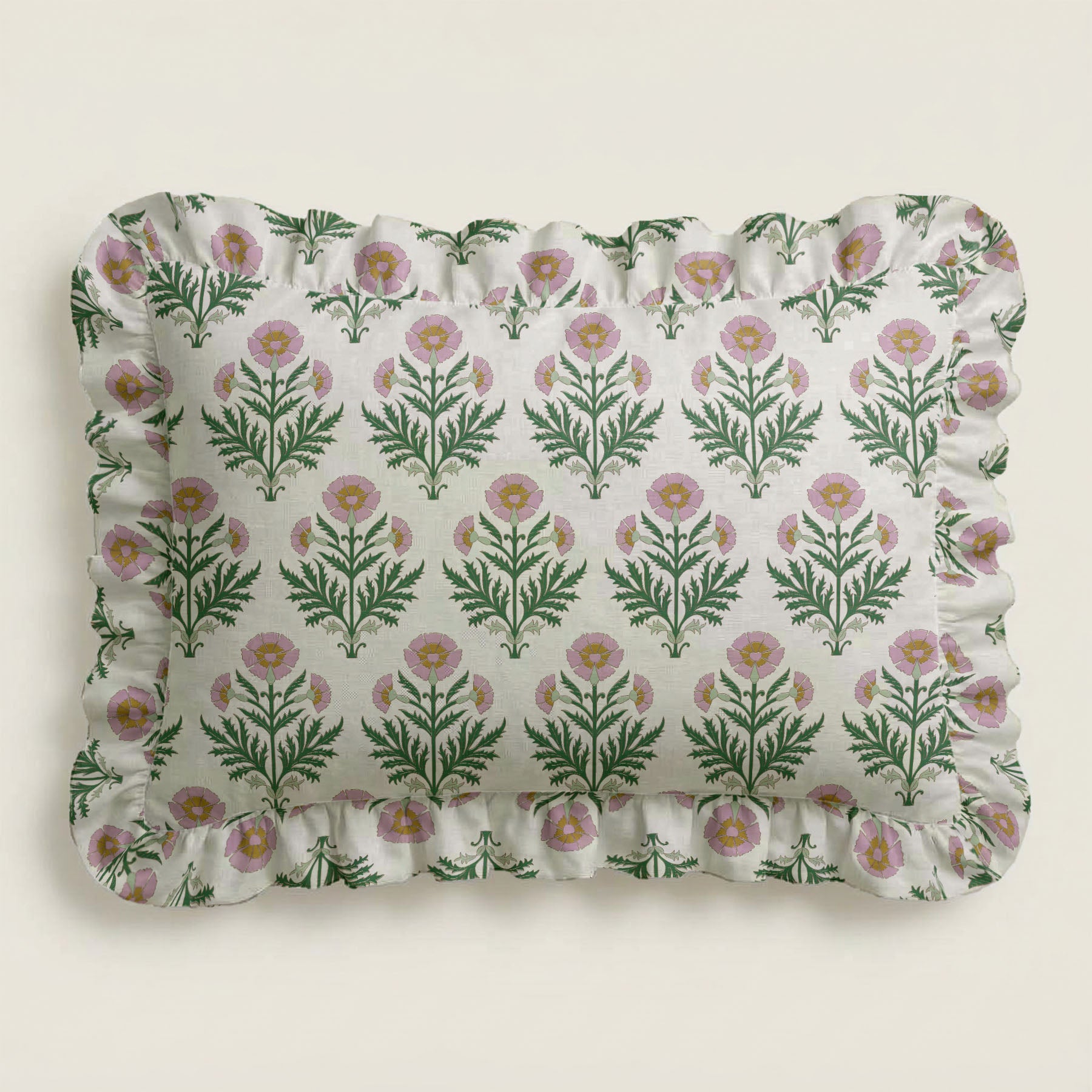 Floral patterned pillow with ruffled edge on a light background