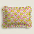 Patterned fabric with yellow and pink design on a light gray background