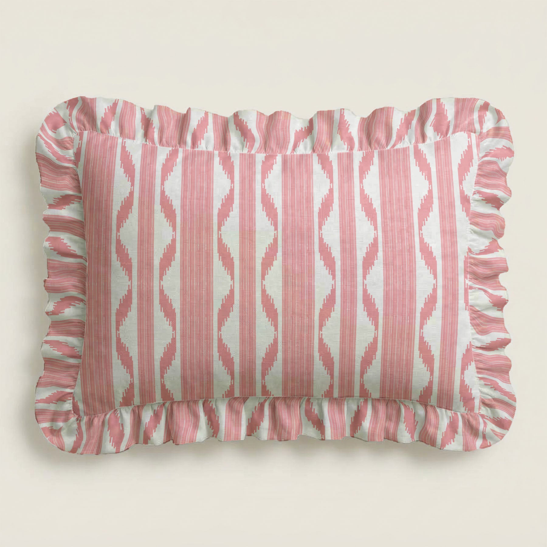 Rectangular pillow with pink and white striped pattern on a beige background