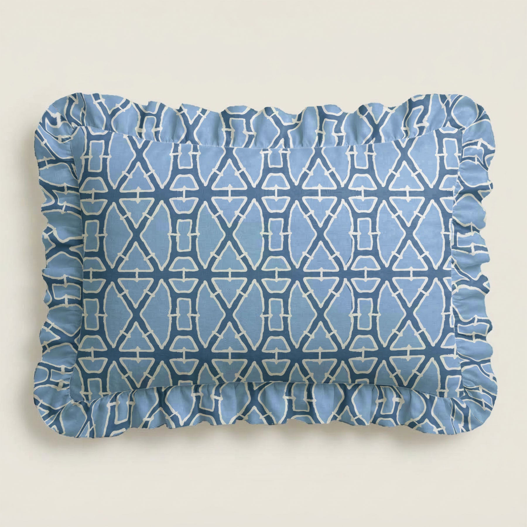 Blue patterned rectangular cushion on a beige background