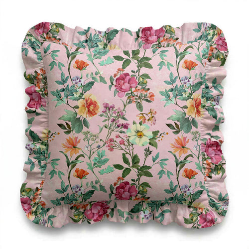 Floral patterned pillow with ruffled edge on a white background