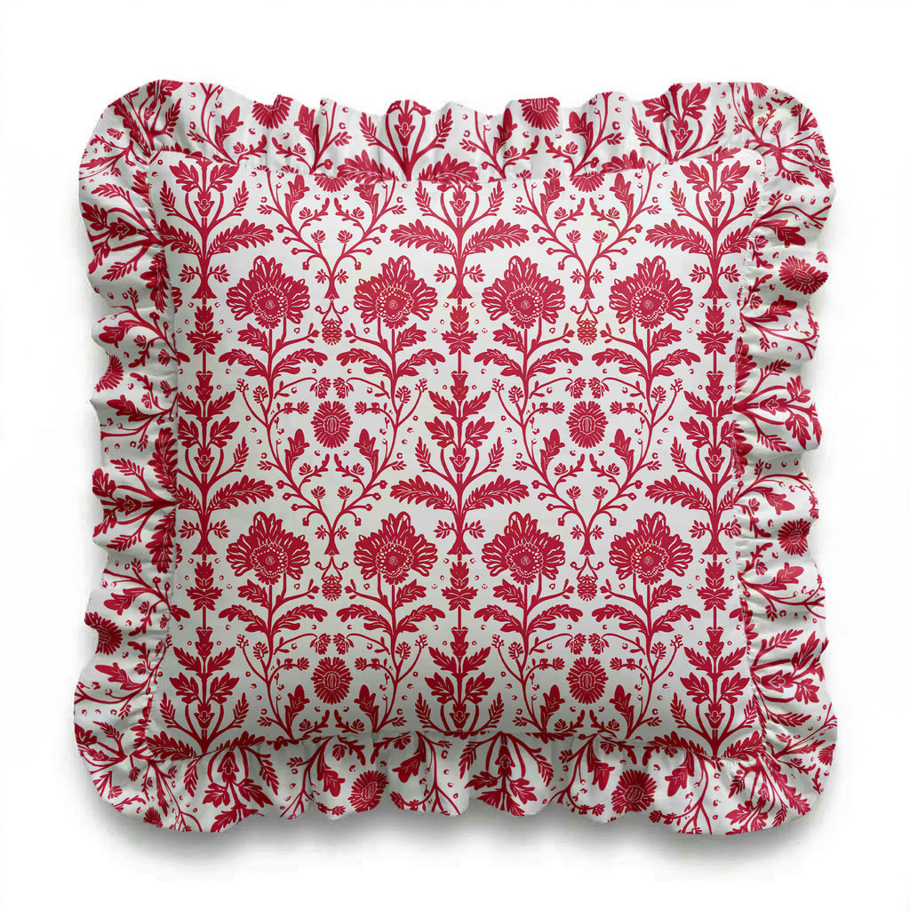 Red floral patterned cushion on a white background