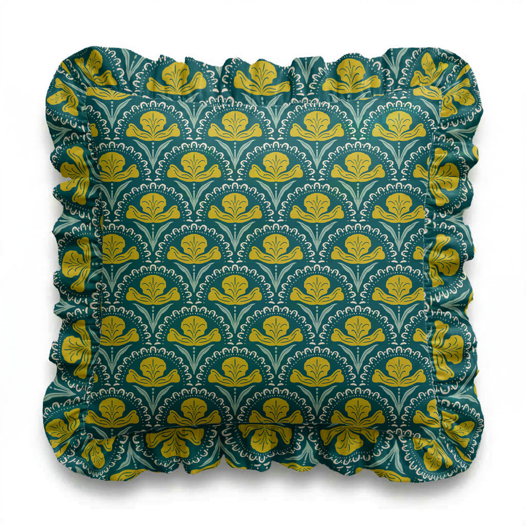 Decorative pillow with green and yellow floral pattern on a white background