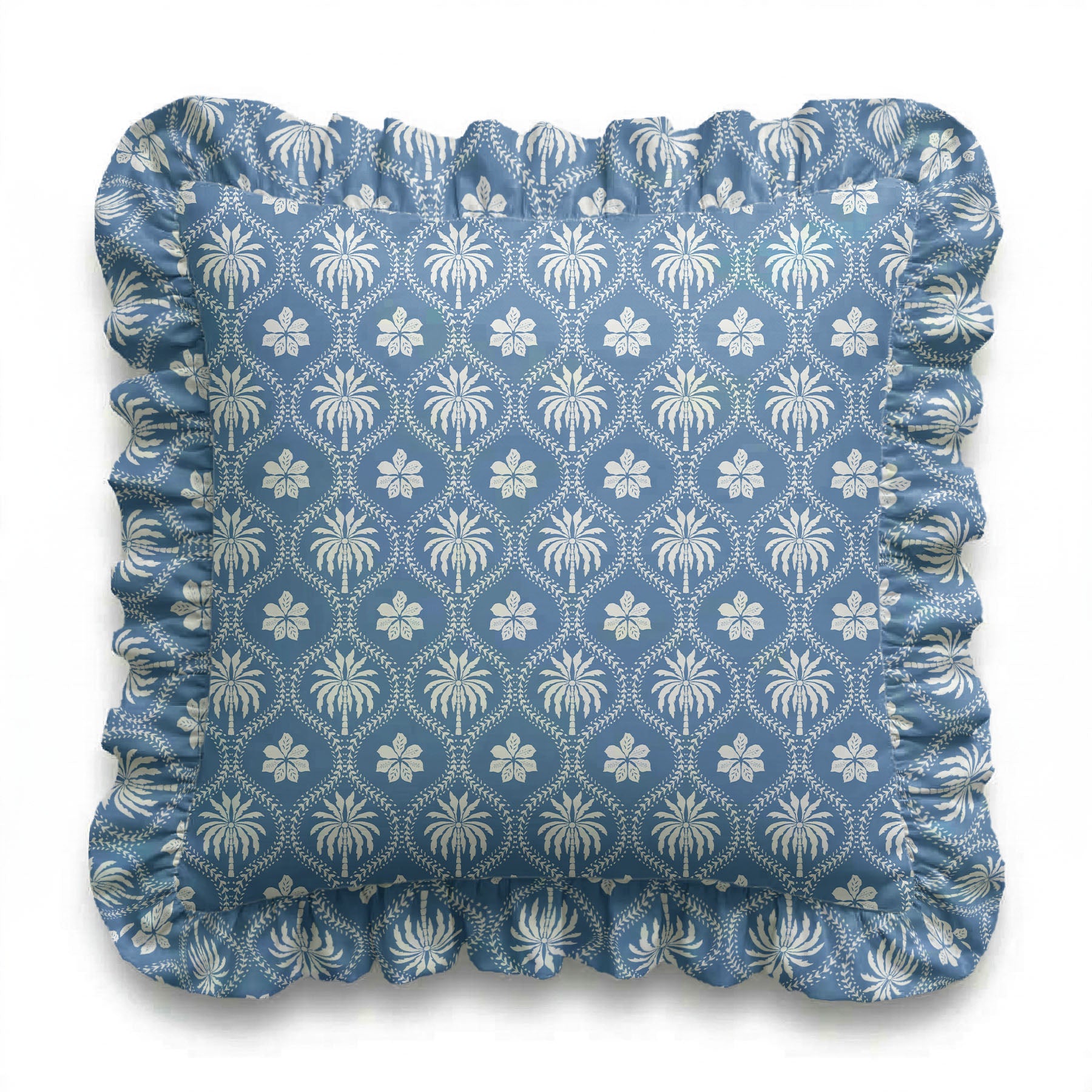 Blue cushion with white floral pattern on a white background
