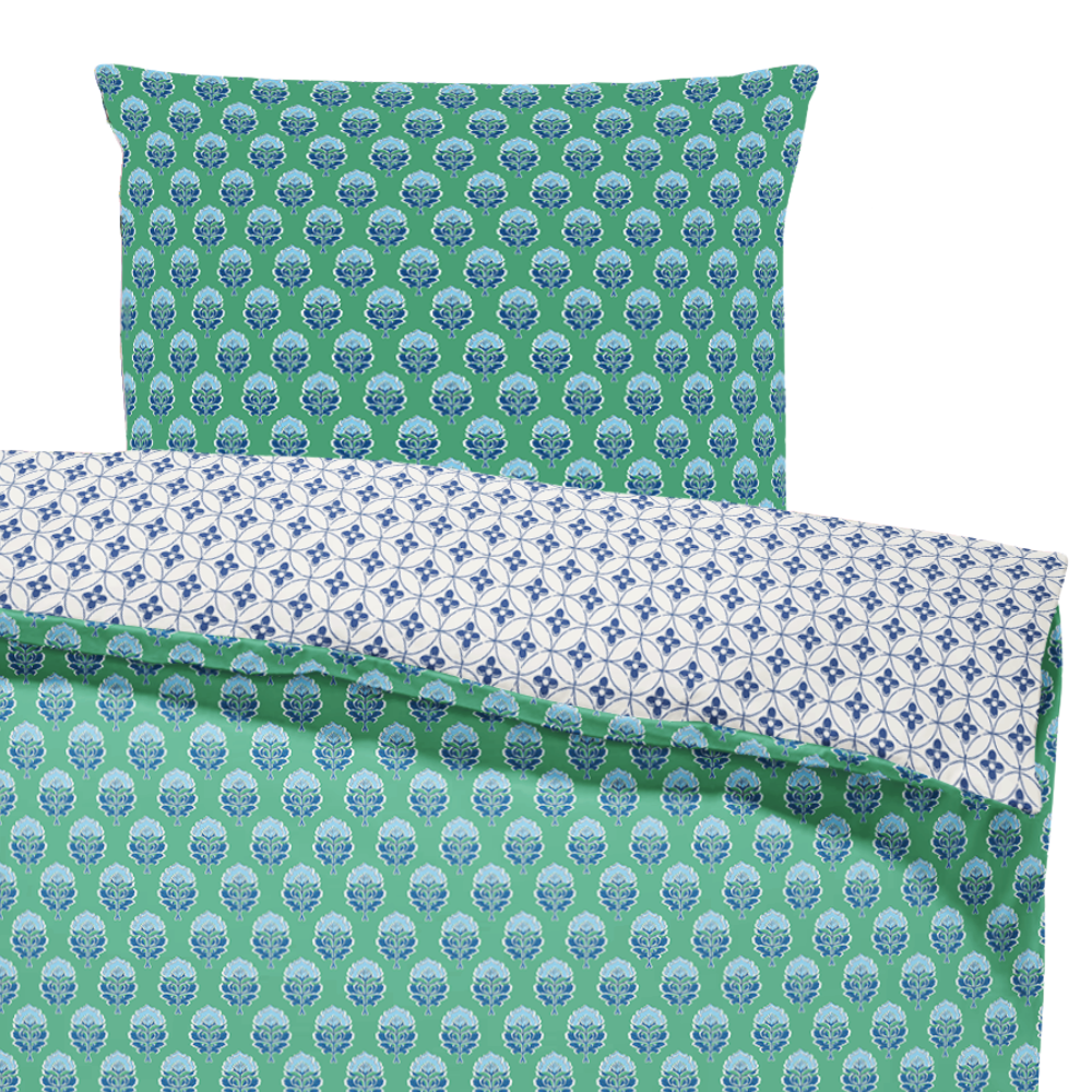 Patterned bed sheets with green and blue design on a white background
