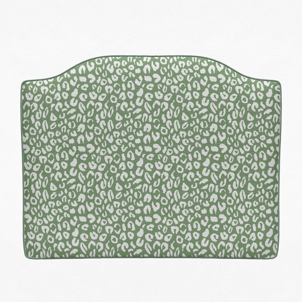 Green headboard with white leopard print pattern on a white background
