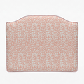 Pink headboard with subtle pattern on a white background