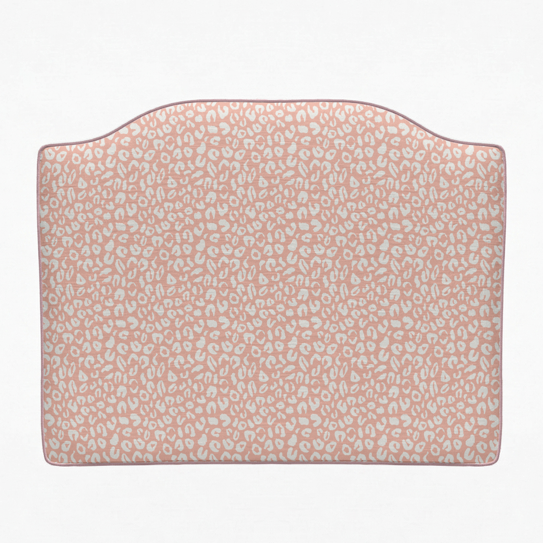 Pink headboard with subtle pattern on a white background